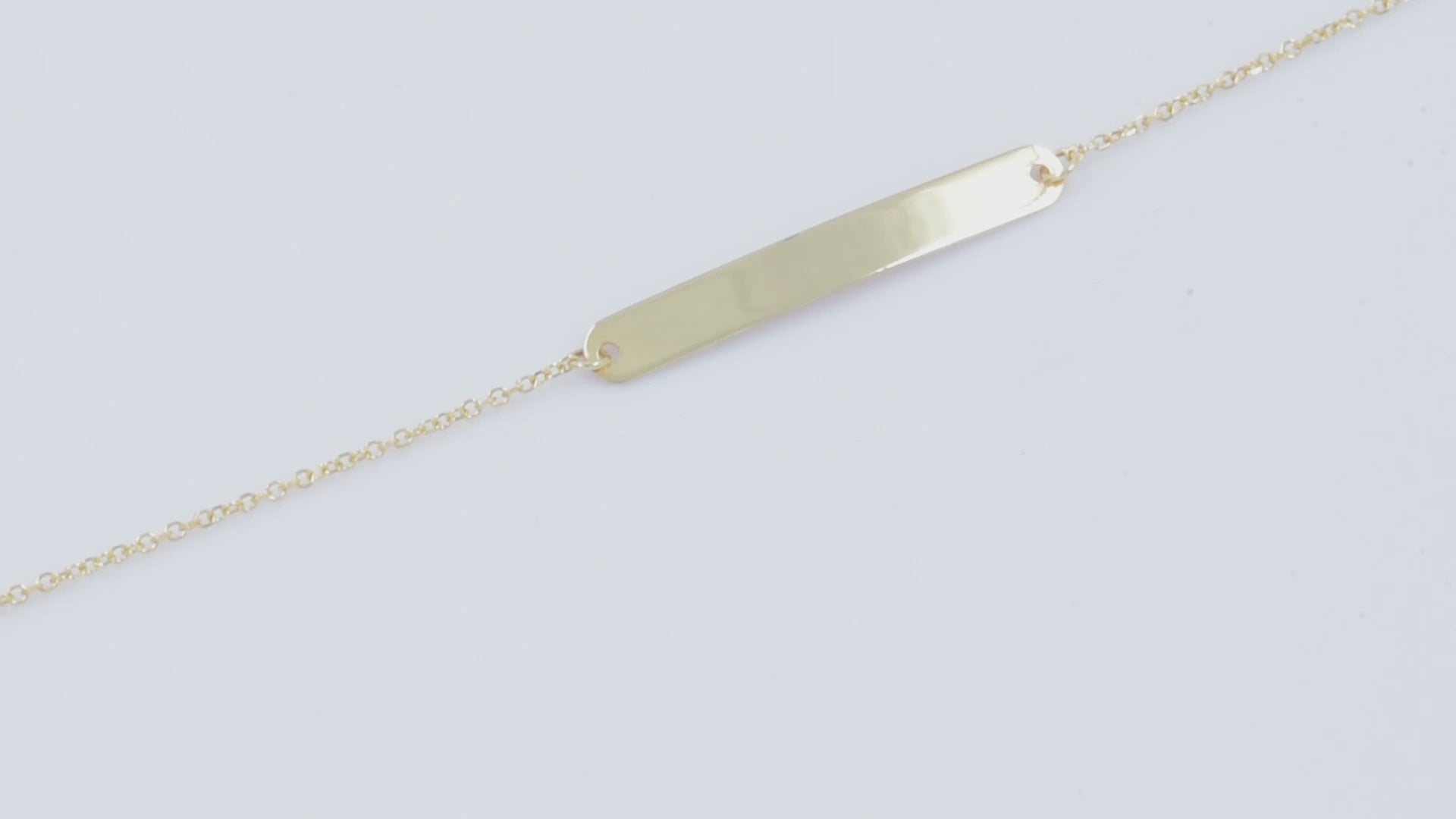 A delicate ID bracelet crafted in 14k gold, customizable for a personal touch.