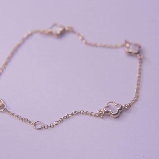 Elegant Mother of Pearl Four-Leaf Clover Bracelet in 14K Gold, Featuring Three Motifs