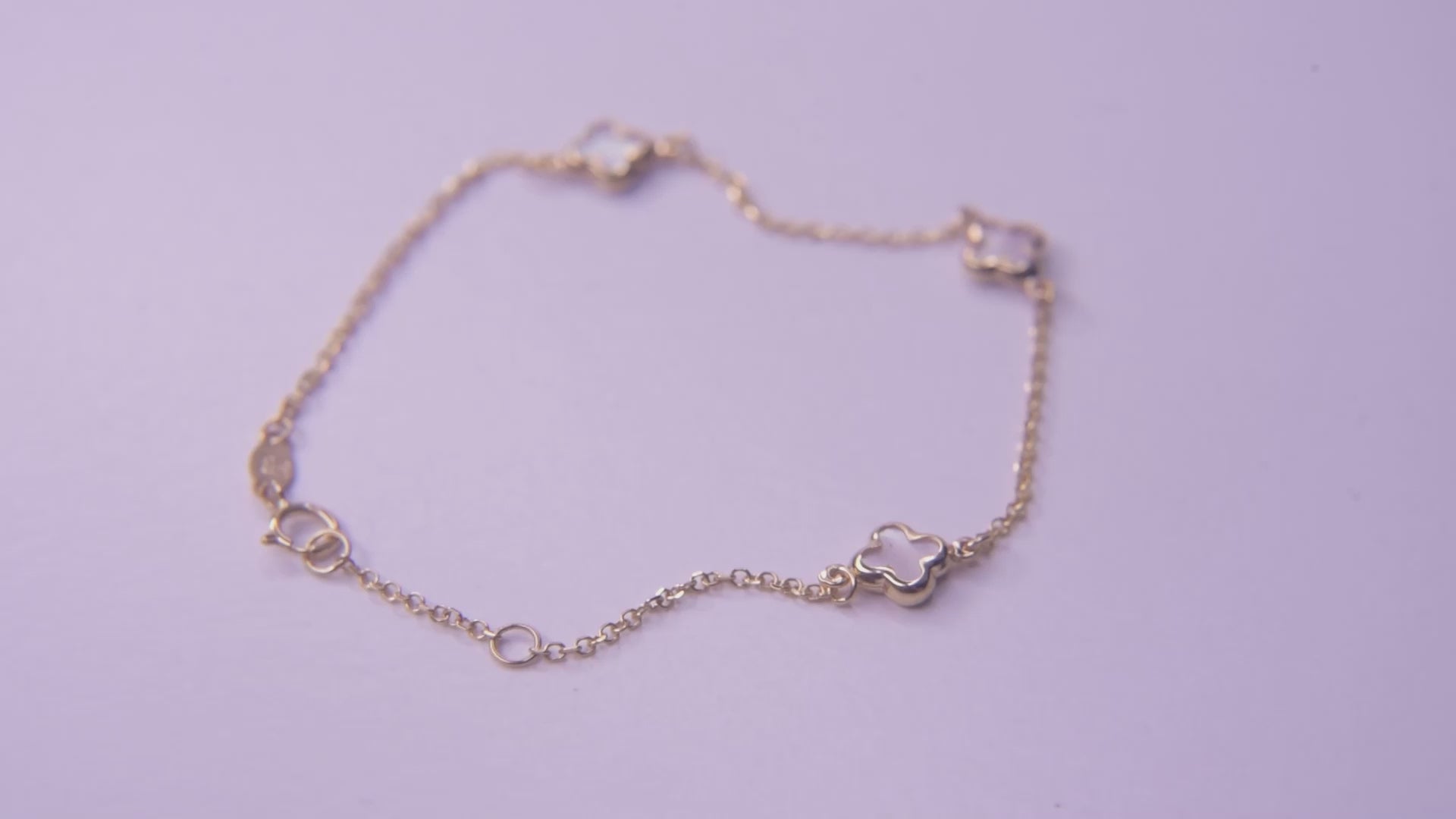 Elegant Mother of Pearl Four-Leaf Clover Bracelet in 14K Gold, Featuring Three Motifs