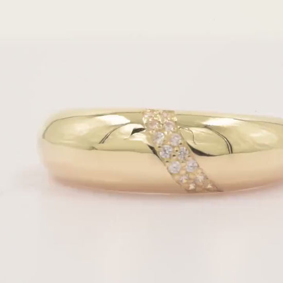 Handmade dome ring in 14k solid gold, partially paved with white cubic zirconia stones.