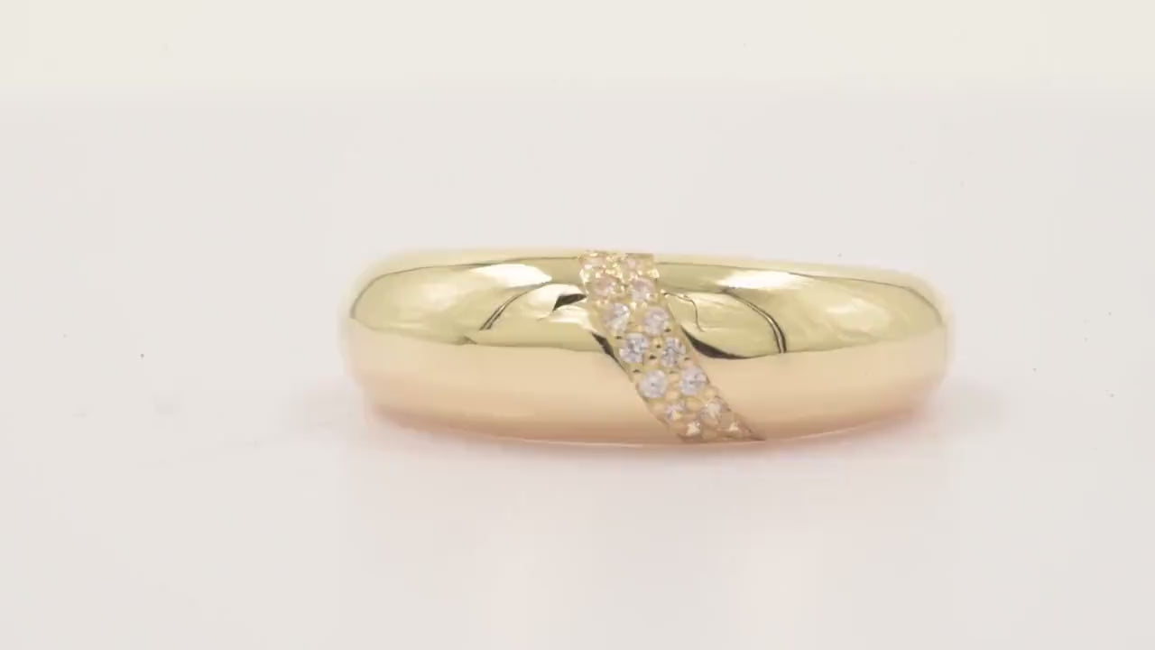 Handmade dome ring in 14k solid gold, partially paved with white cubic zirconia stones.