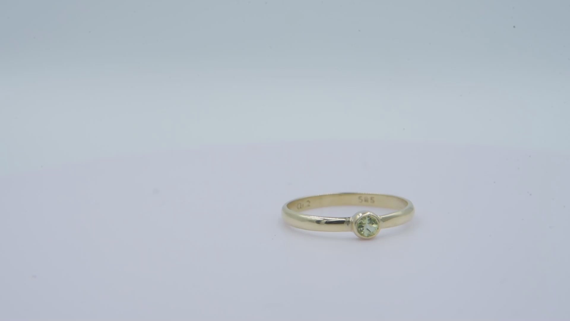 A handmade birthstone ring crafted in 14k solid gold, featuring a single stone in a bezel setting.