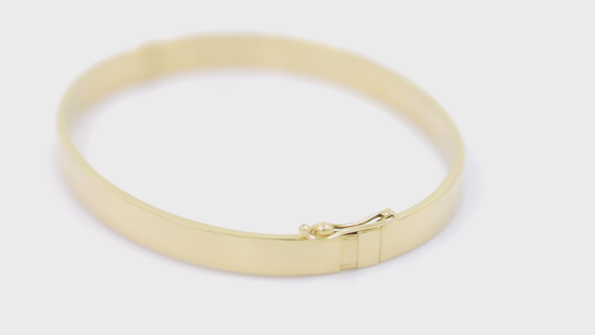 A 6.00mm hinged bangle bracelet crafted in 14k gold for women.