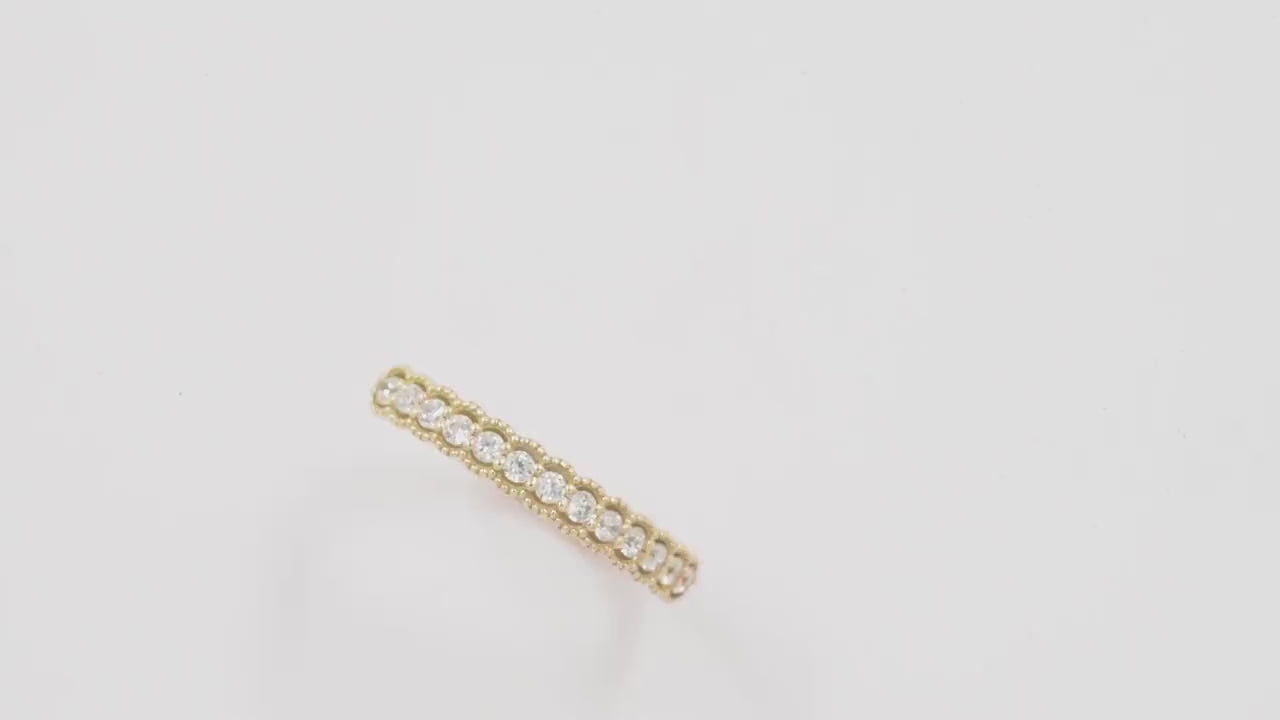 A women's half-eternity band ring featuring white cubic zirconia stones set in 14k gold.