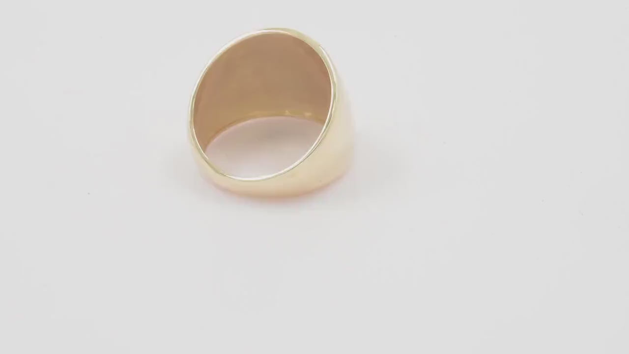 A large dome-shaped signet ring for women, crafted in 14k gold.