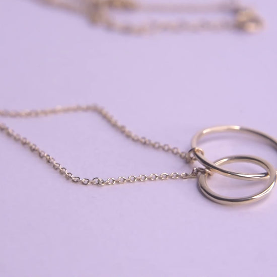 14k gold necklace with two interlocking circles 