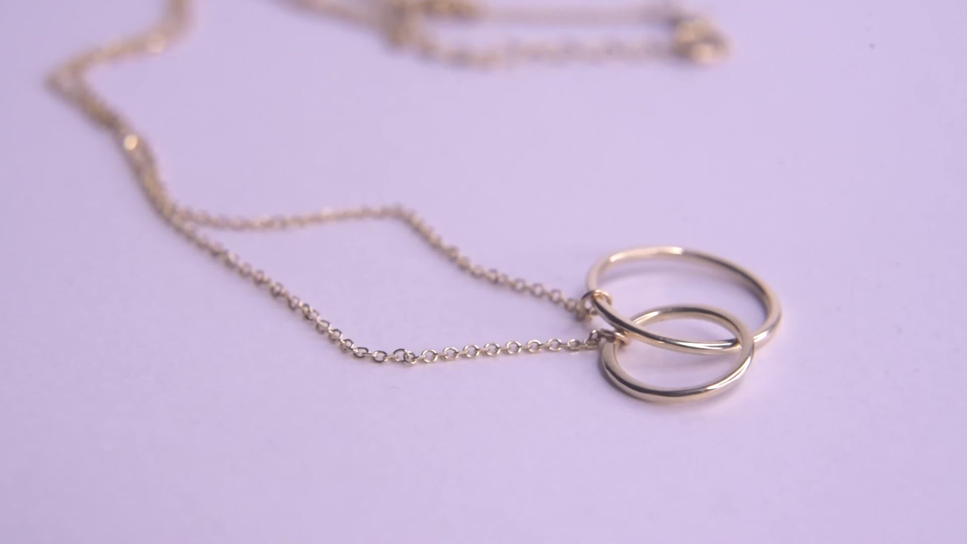 14k gold necklace with two interlocking circles 