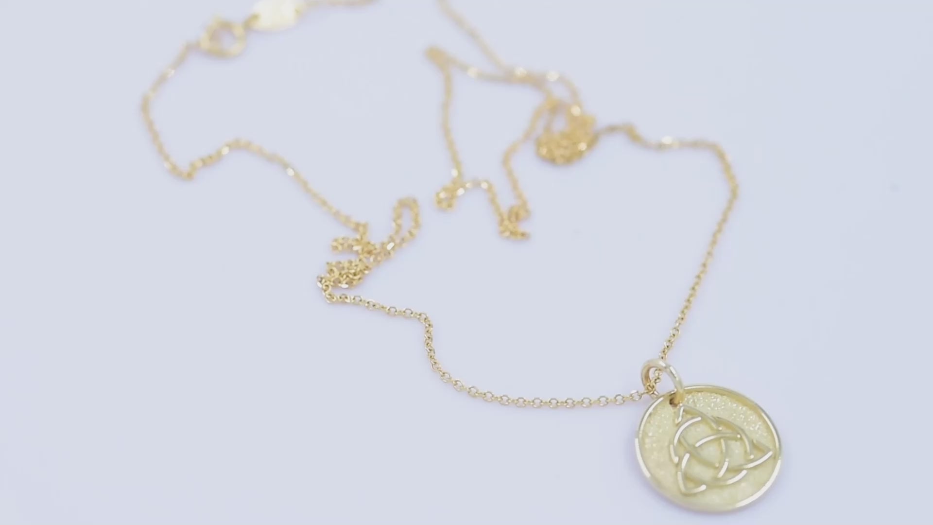 Trinity Knot Necklace in 14k solid gold for women, with complimentary engraving on the reverse side.