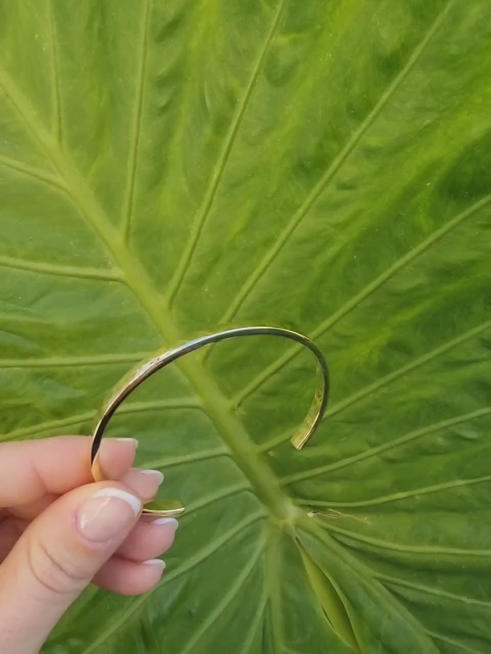 A 4.40mm open cuff bangle bracelet crafted in 14k gold for women.