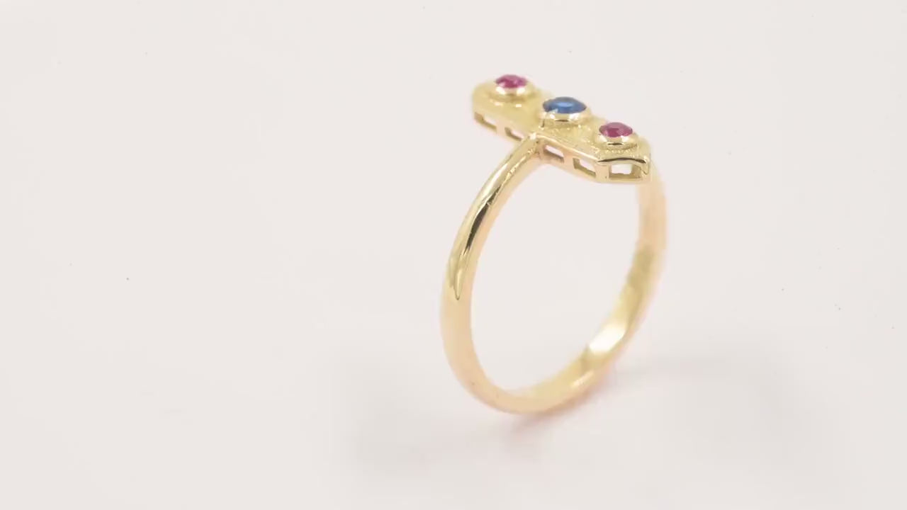 Handcrafted arrow-shaped gold ring with three gemstones set in 14k solid gold.