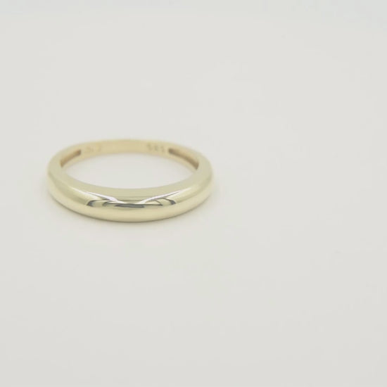 A thin dome ring made of 14k solid gold for women.