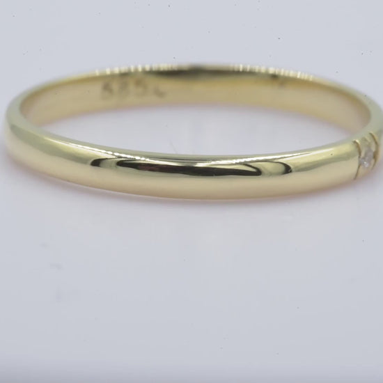 A minimalist diamond band ring crafted in 14k solid gold for women.