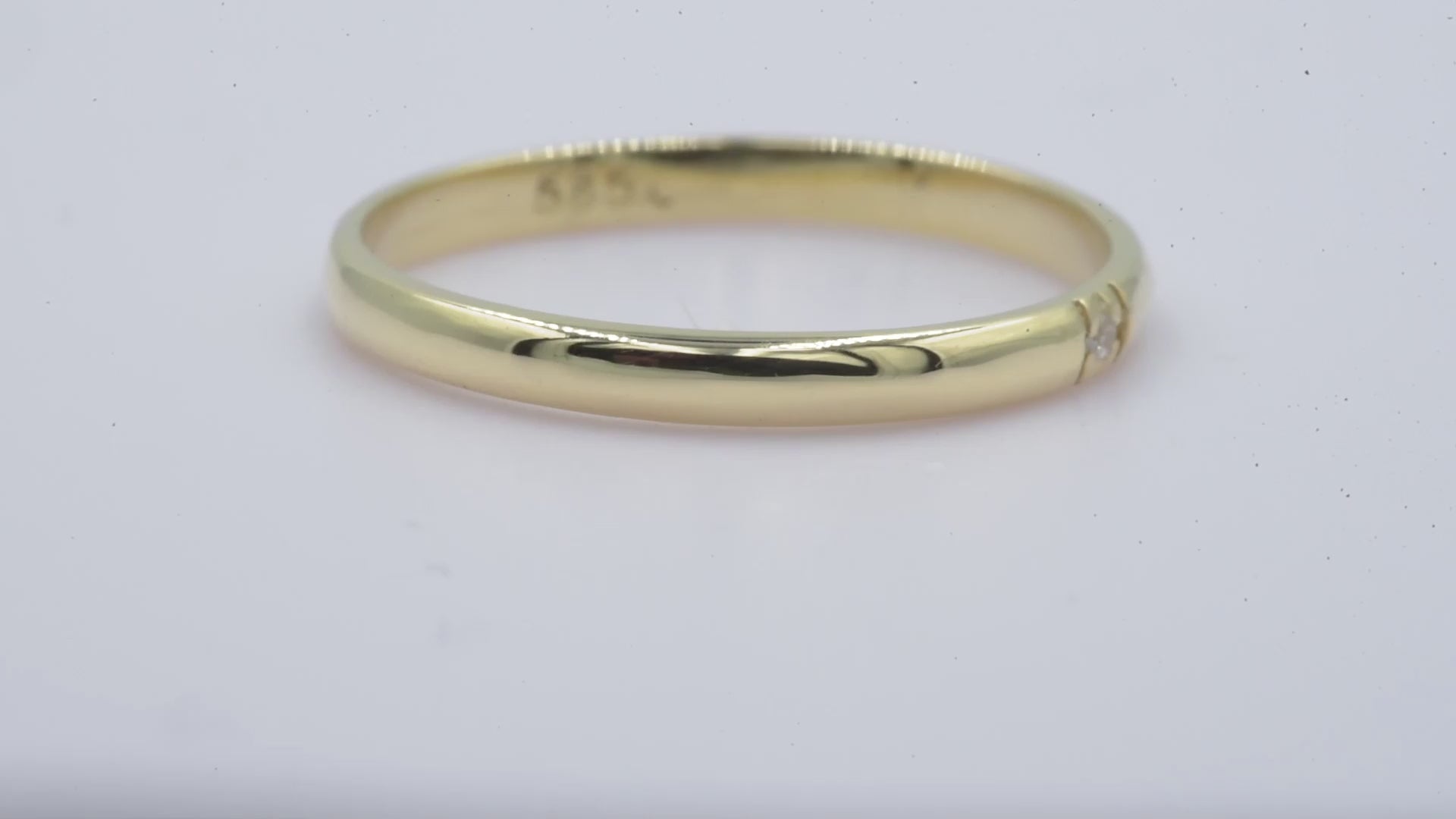 A minimalist diamond band ring crafted in 14k solid gold for women.