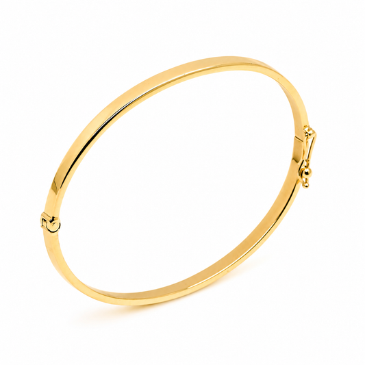 14k Gold bangle on a white background