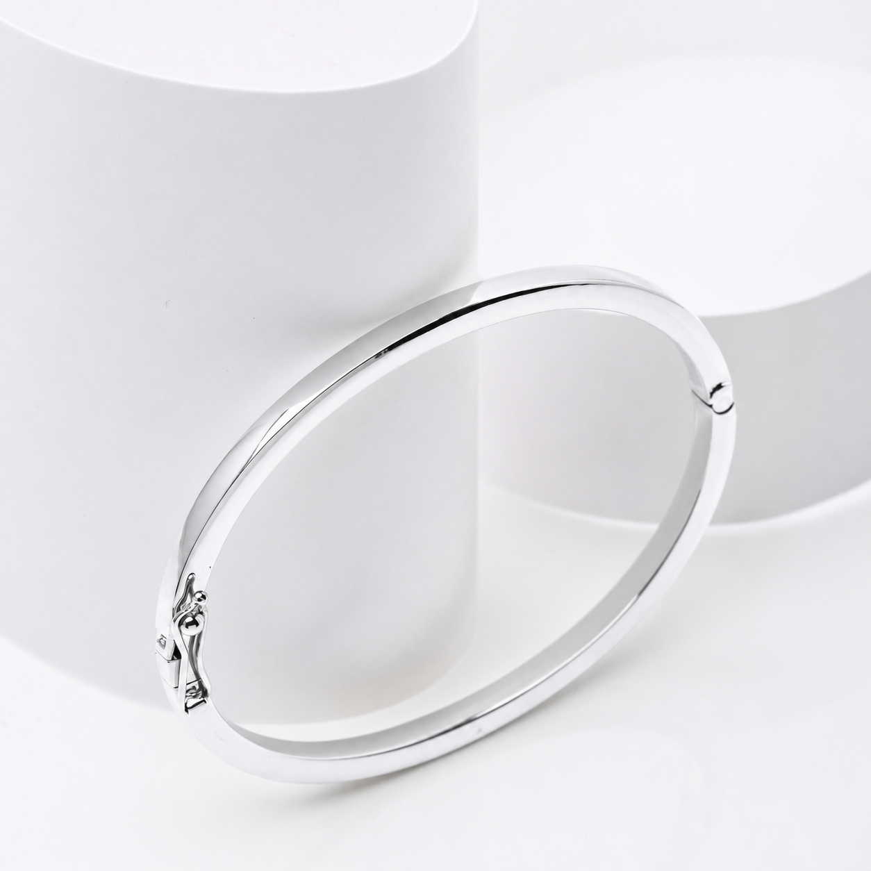 14k white Gold bangle bracelet on a white background