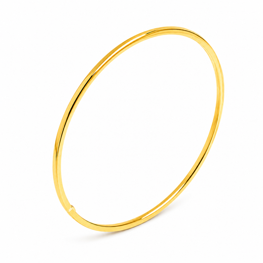 14k yellow gold slip on bangle bracelet on a white background