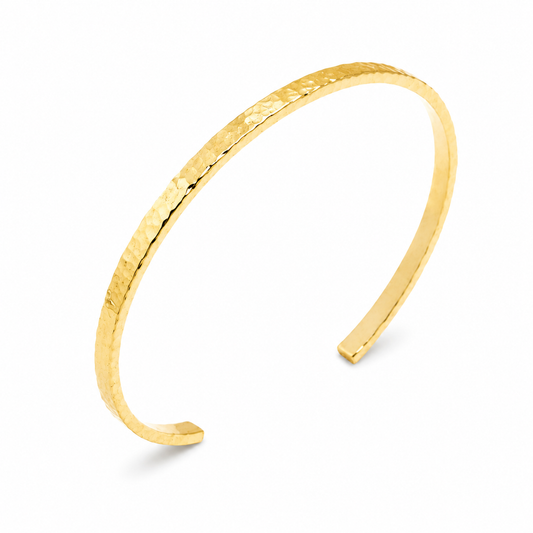 14k yellow gold cuff bangle bracelet in a white backgound
