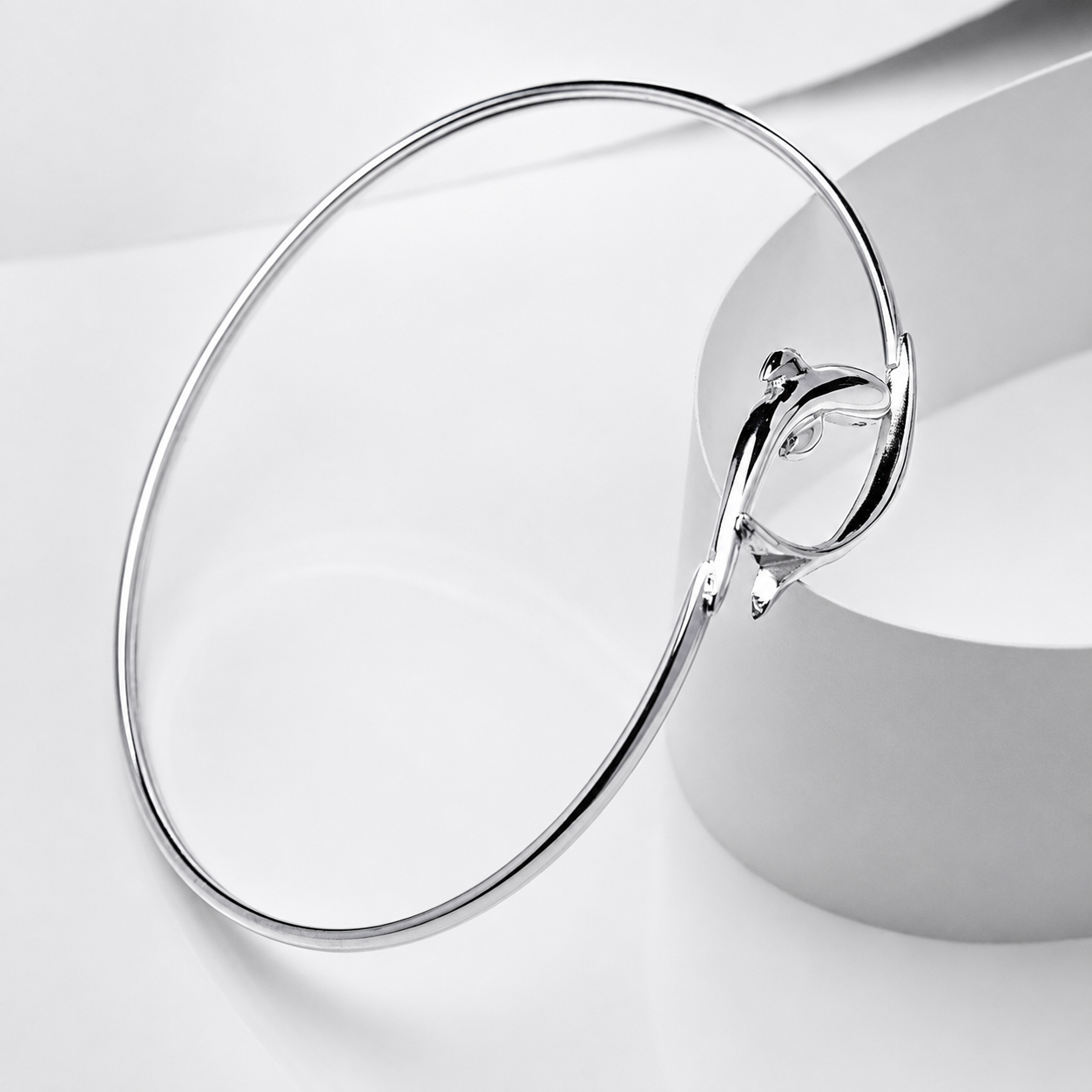 14k white solid gold dolphin bracelet on a white background