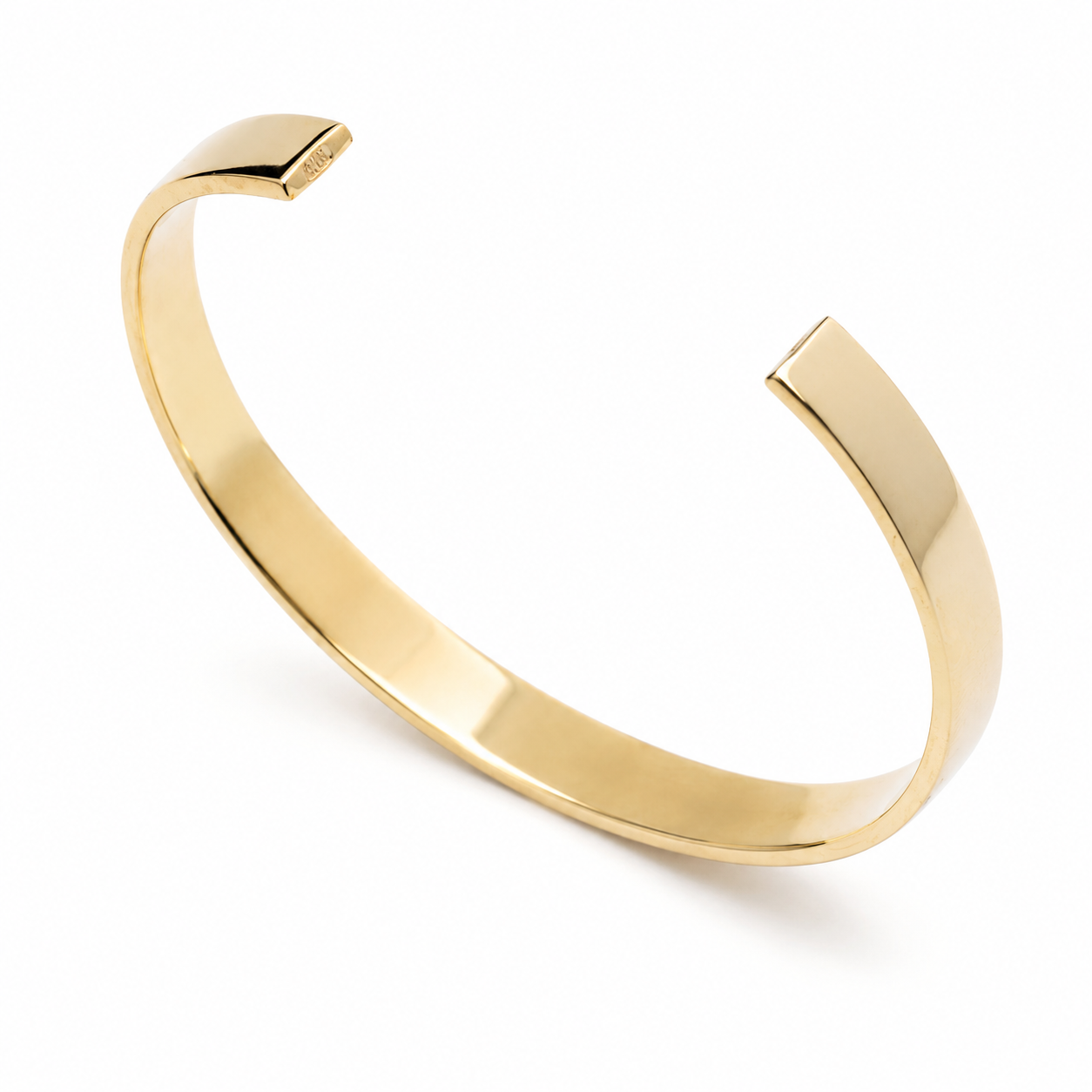 14k yellow Gold bangle on a white background