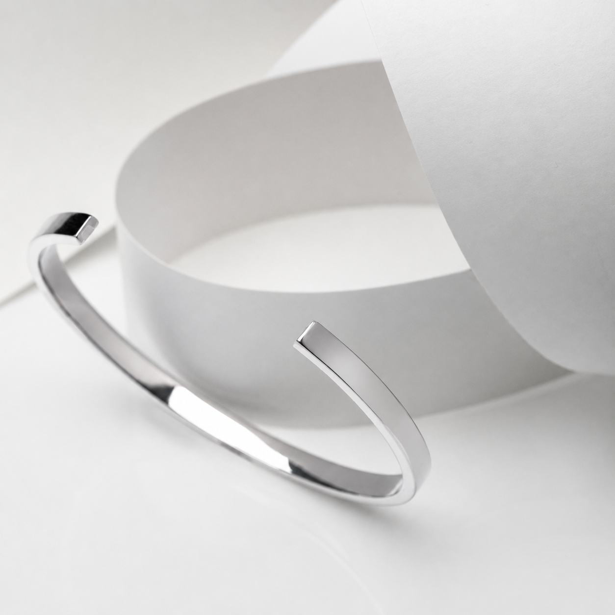 14k white Gold cuff bangle bracelet on a white background
