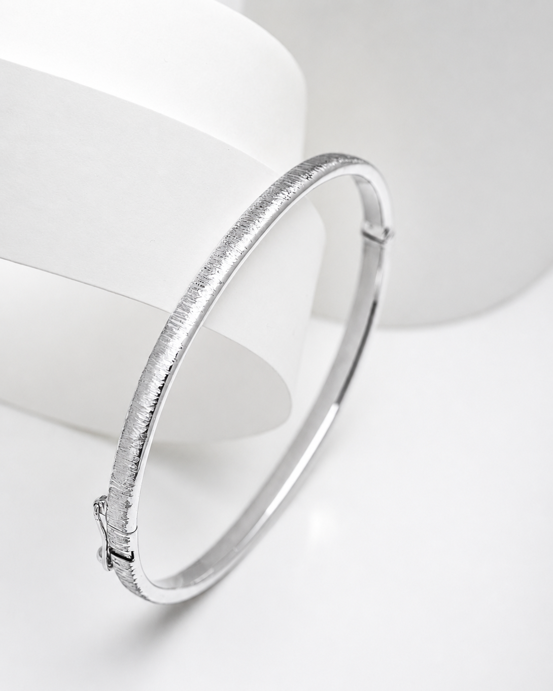 14k white Gold sandbalsted bangle on a white background