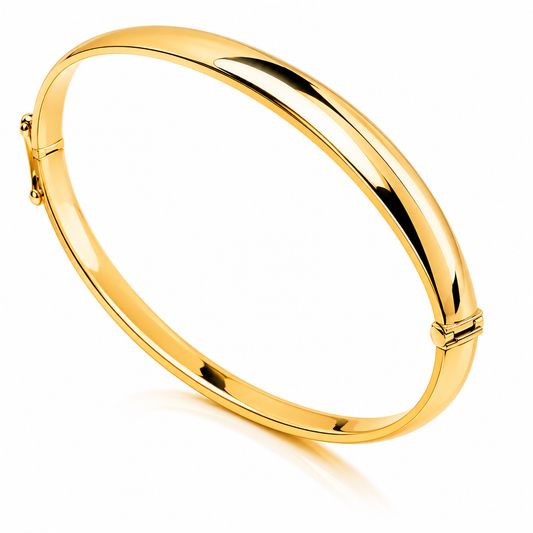 14k Gold bangle on a white background
