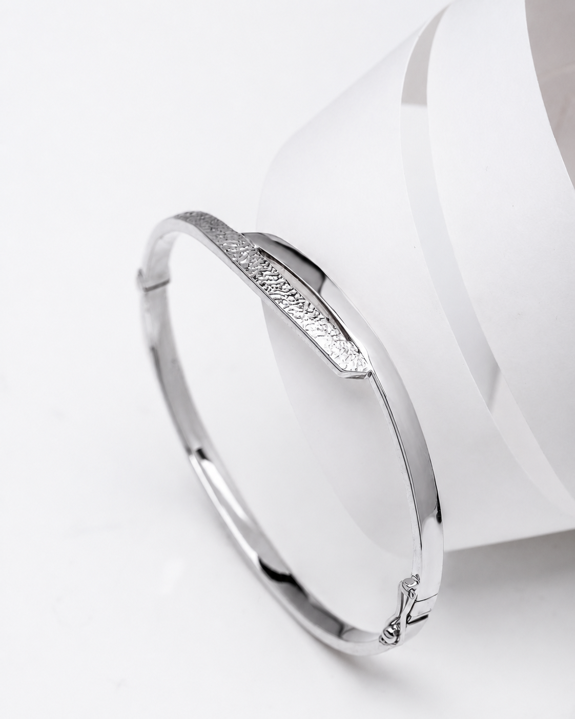 baypass 14k white Gold bangle on a white background