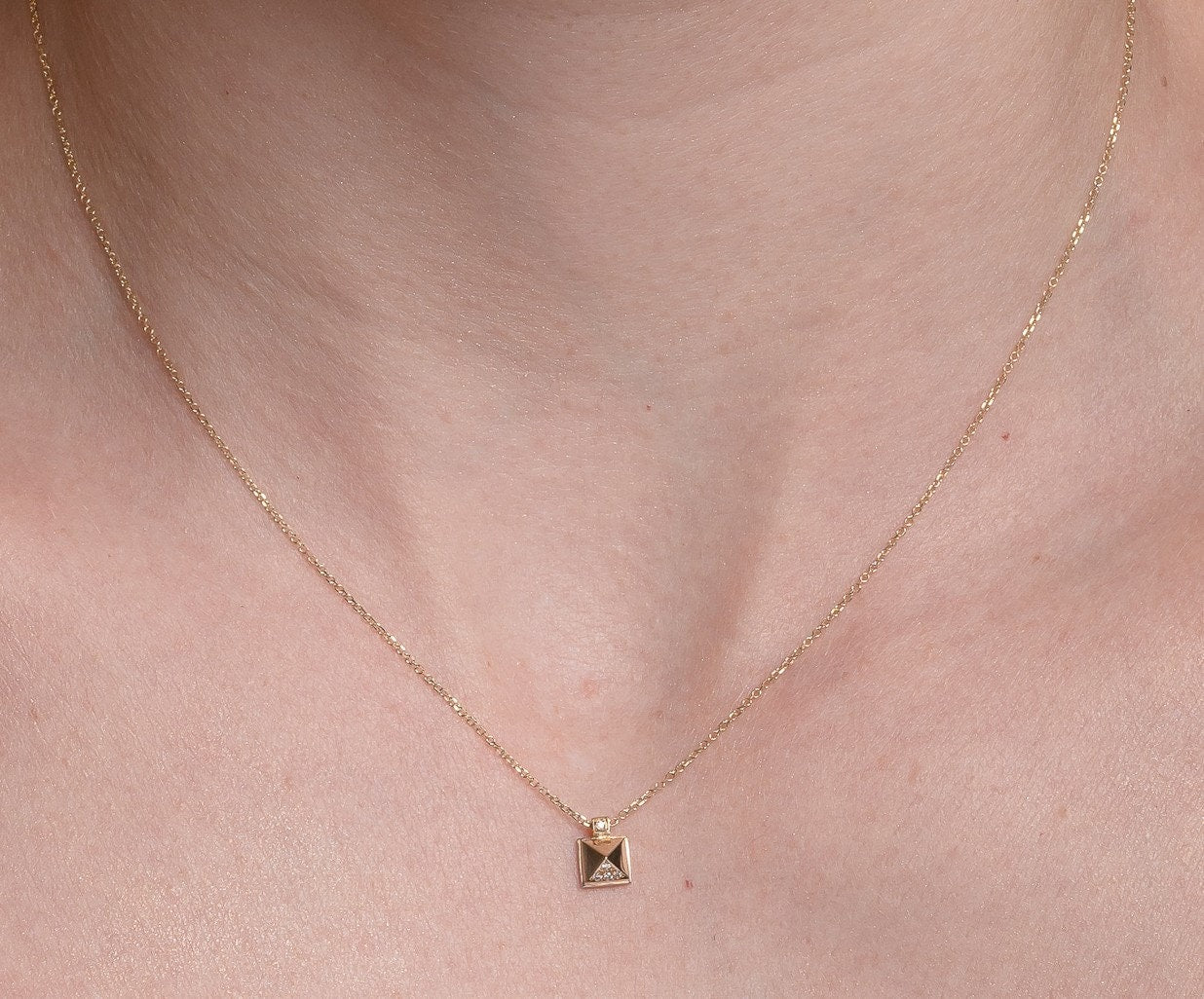 Pyramid Diamond Necklace in 18k Gold worn by a model 