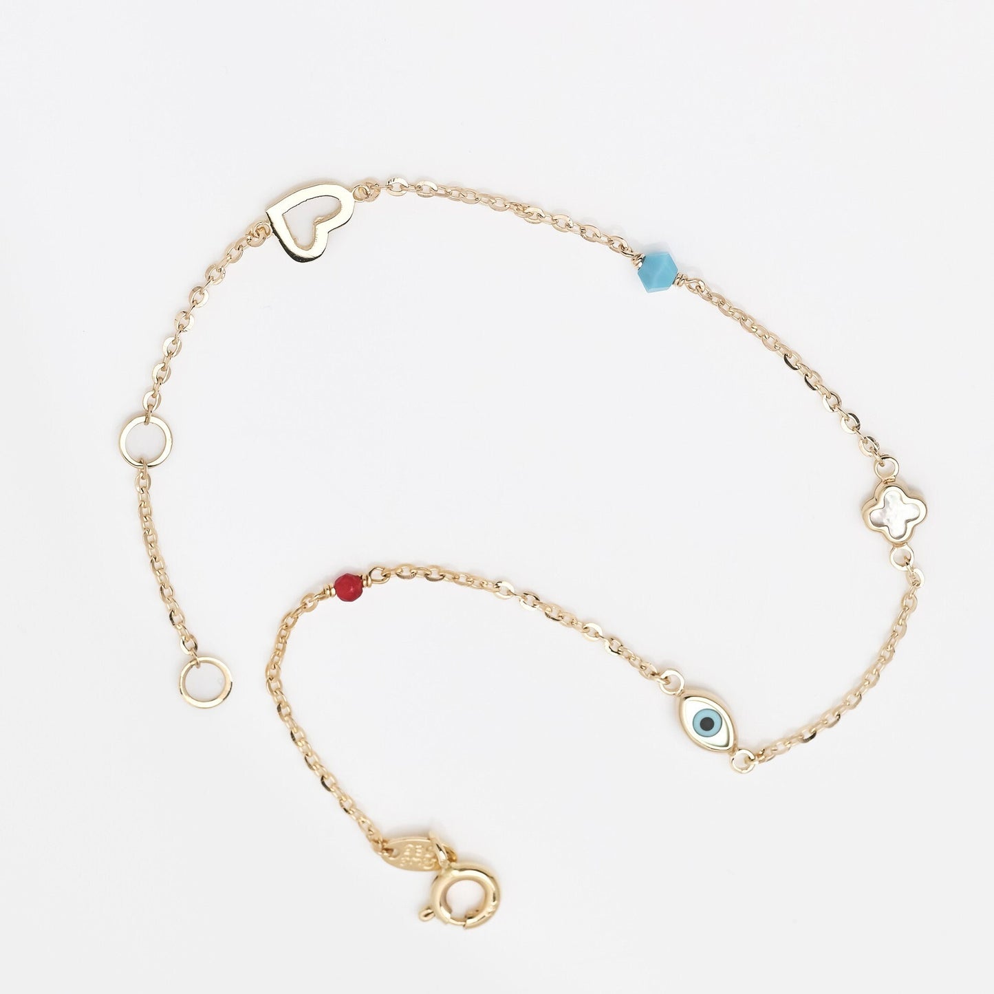 14k gold charm bracelet with afour leaf clover,heart,evil eye, turquoise and tourmaline stone