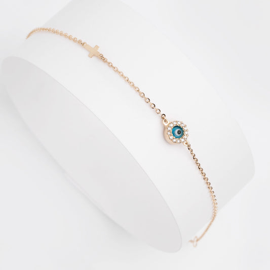 round evil eye bracelet with mourano glass and cubic zirconia stones and a small cross