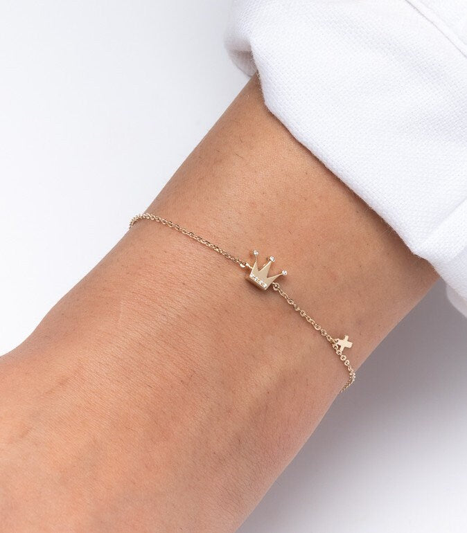 Crown and Cross Charm Bracelet in 14k Gold for Women, Modeled by a Professional