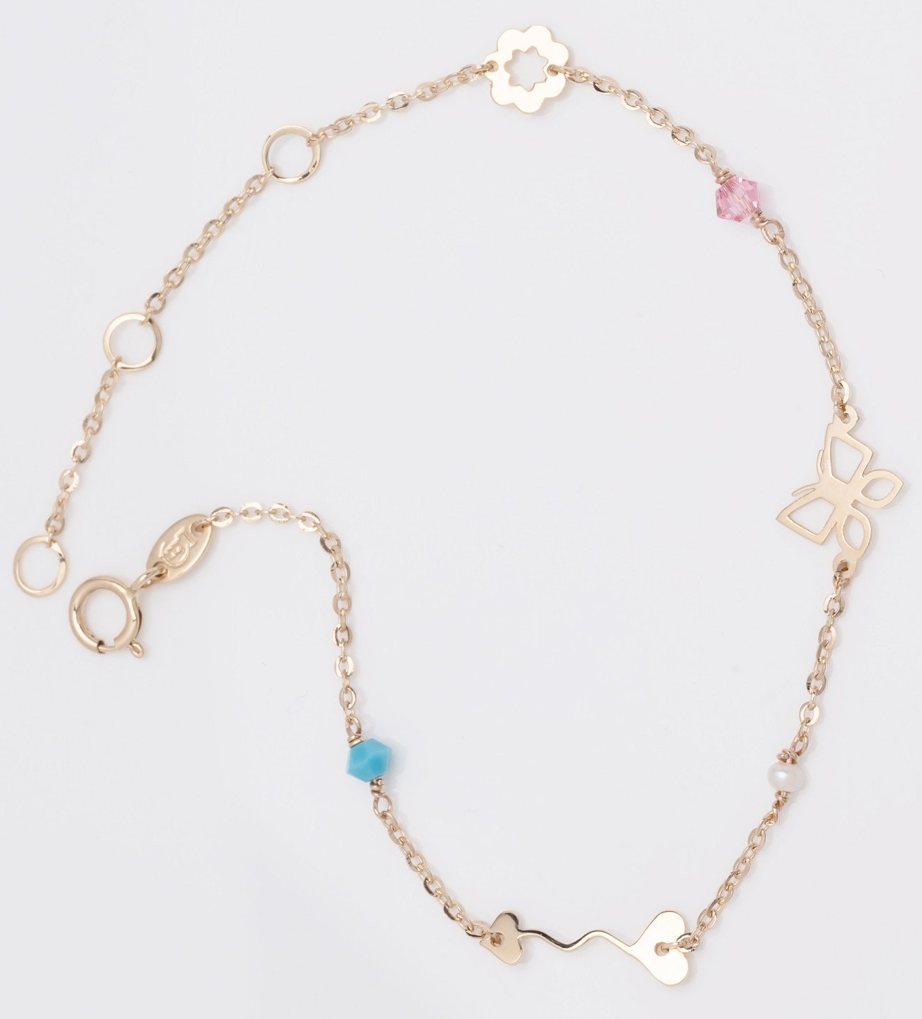 A 14k gold charm bracelet featuring an arrow, a flower, a butterfly, and three colorful gemstones.