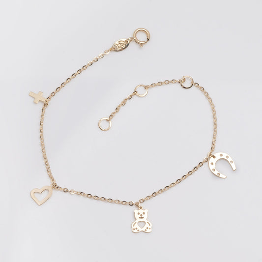 14k gold bracelet with hangginh charms, cross, heart, bear, horseshoe