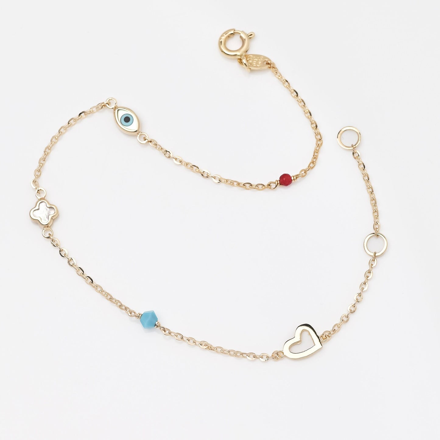 14k gold charm bracelet with afour leaf clover,heart,evil eye, turquoise and tourmaline stone