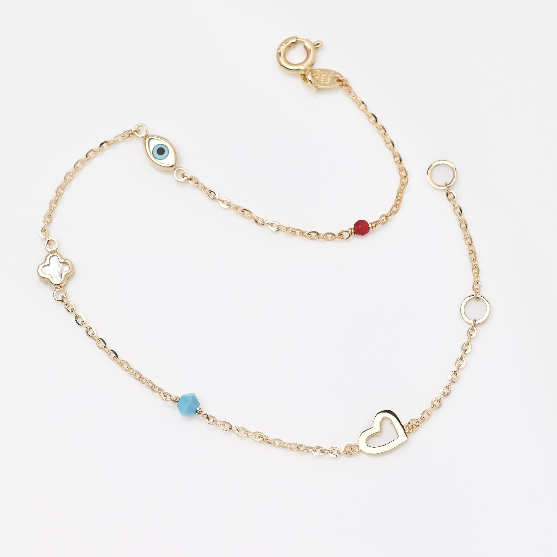 14k gold charm bracelet with afour leaf clover,heart,evil eye, turquoise and tourmaline stone