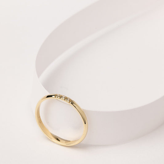 A women's diamond band ring crafted in 14k solid gold.