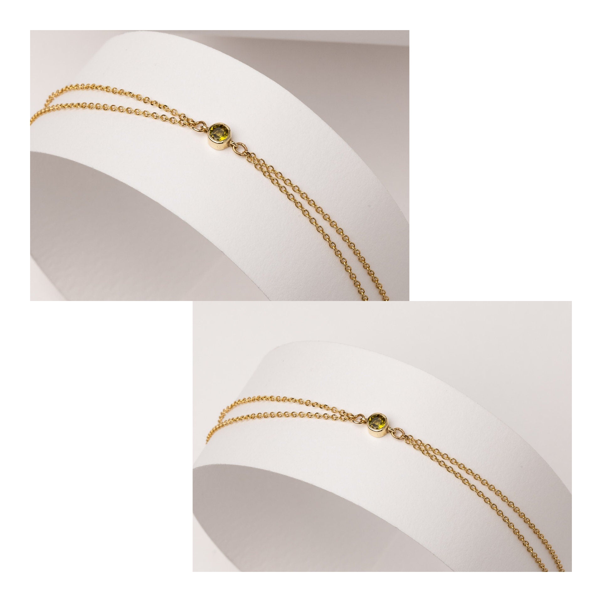 A handmade bracelet featuring a single birthstone in a bezel setting, crafted in 14k gold with a double chain design.