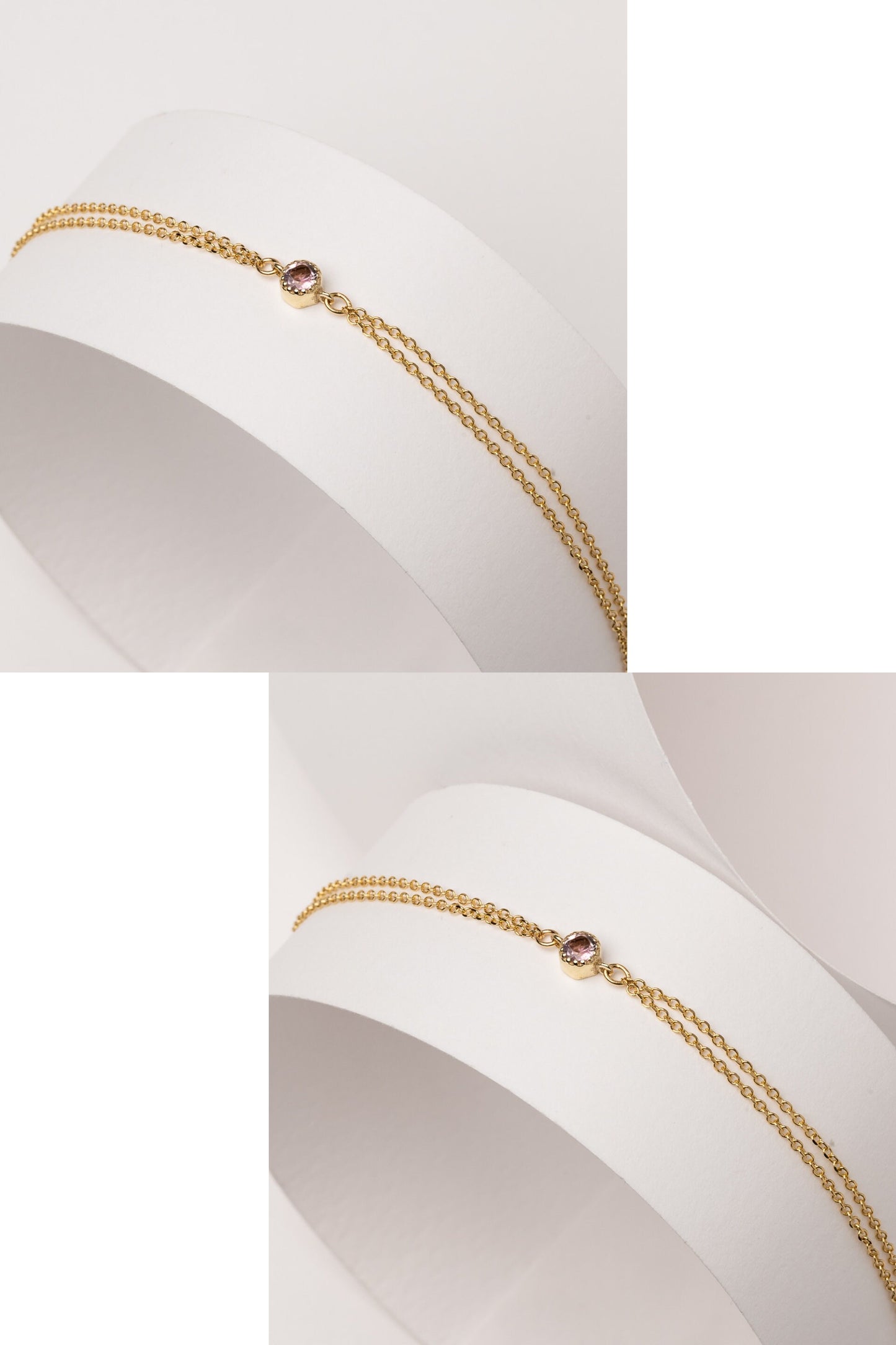 A handmade bracelet featuring a single birthstone set in 14k gold, complemented by a double chain design.