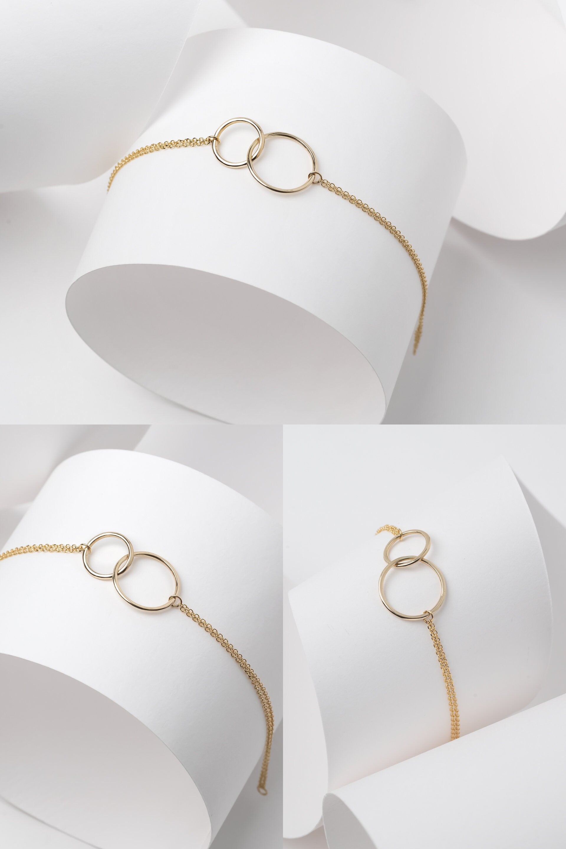 Interlocking bracelet crafted from 14k gold, featuring a double chain design.