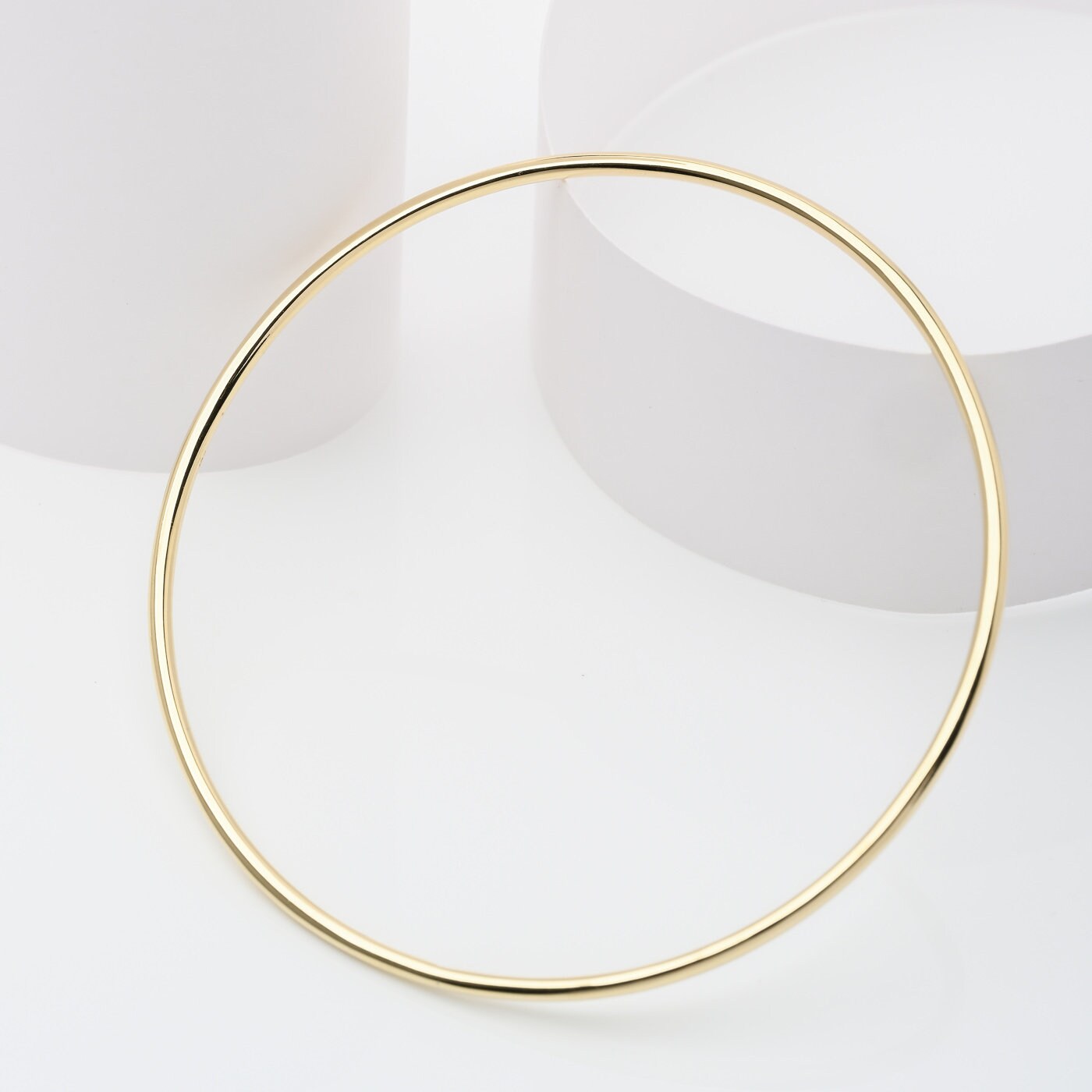 Slip-on 14k solid gold bangle bracelet for women.