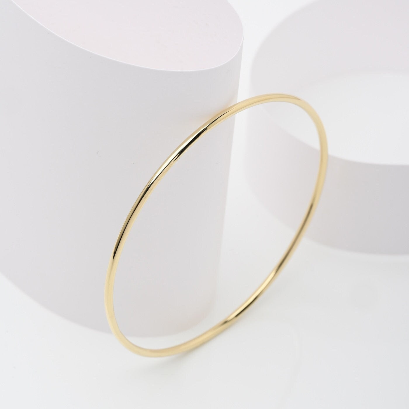 Slip-on 14k solid gold bangle bracelet for women.