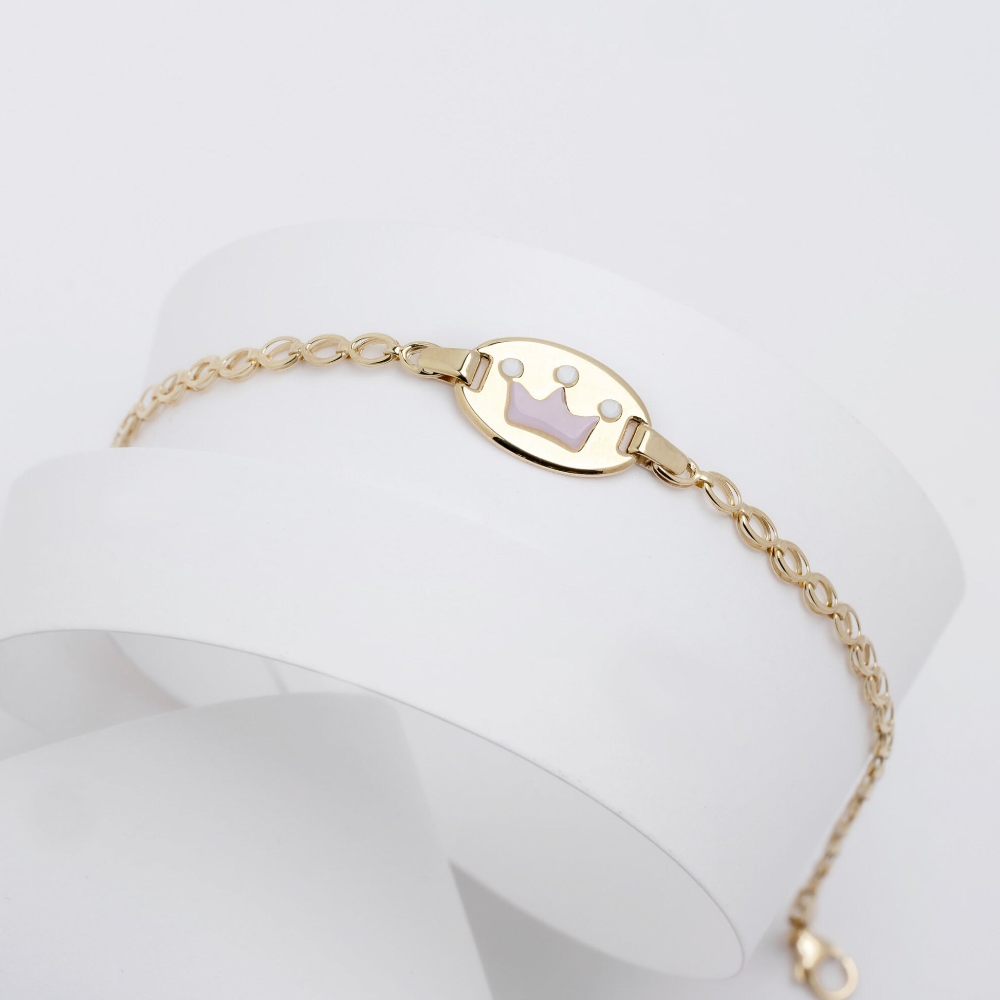 kids bracelet with an enamel crown in 14k gold