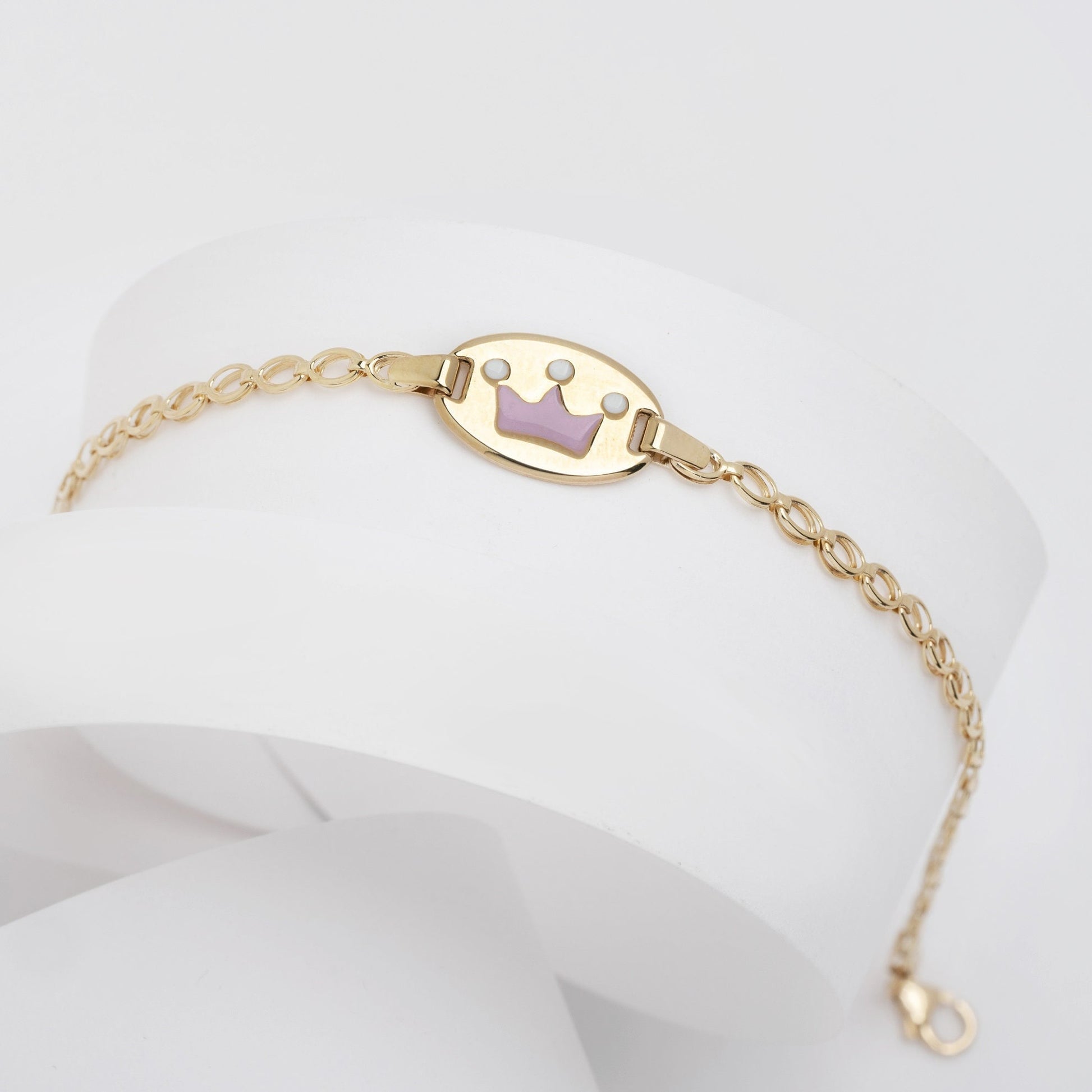 kids bracelet with an enamel crown in 14k gold