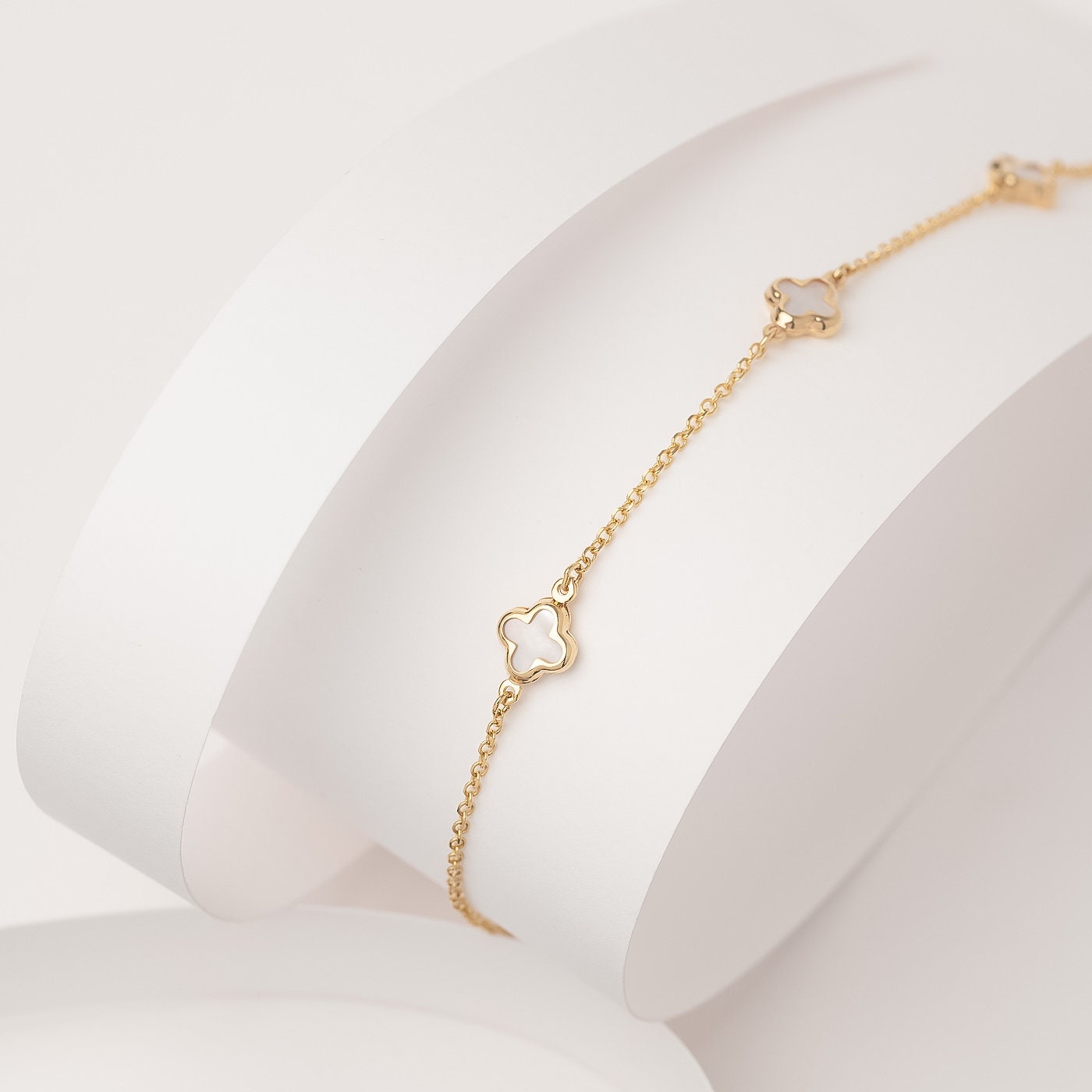 Elegant Mother of Pearl Four-Leaf Clover Bracelet in 14K Gold, Featuring Three Motifs