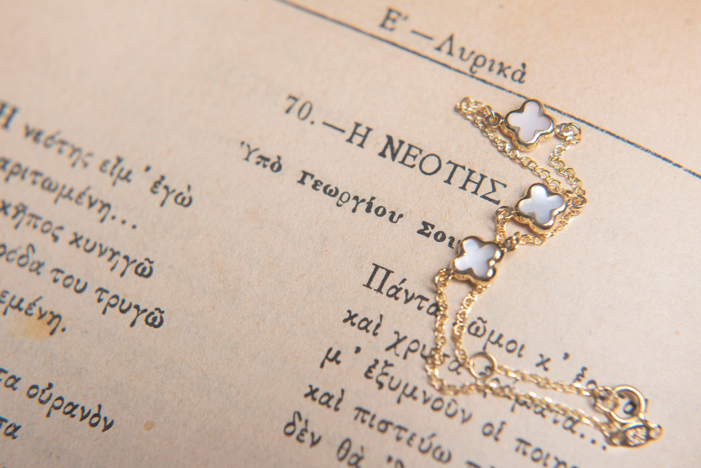 Elegant Mother of Pearl Four-Leaf Clover Bracelet in 14K Gold, Featuring Three Motifs