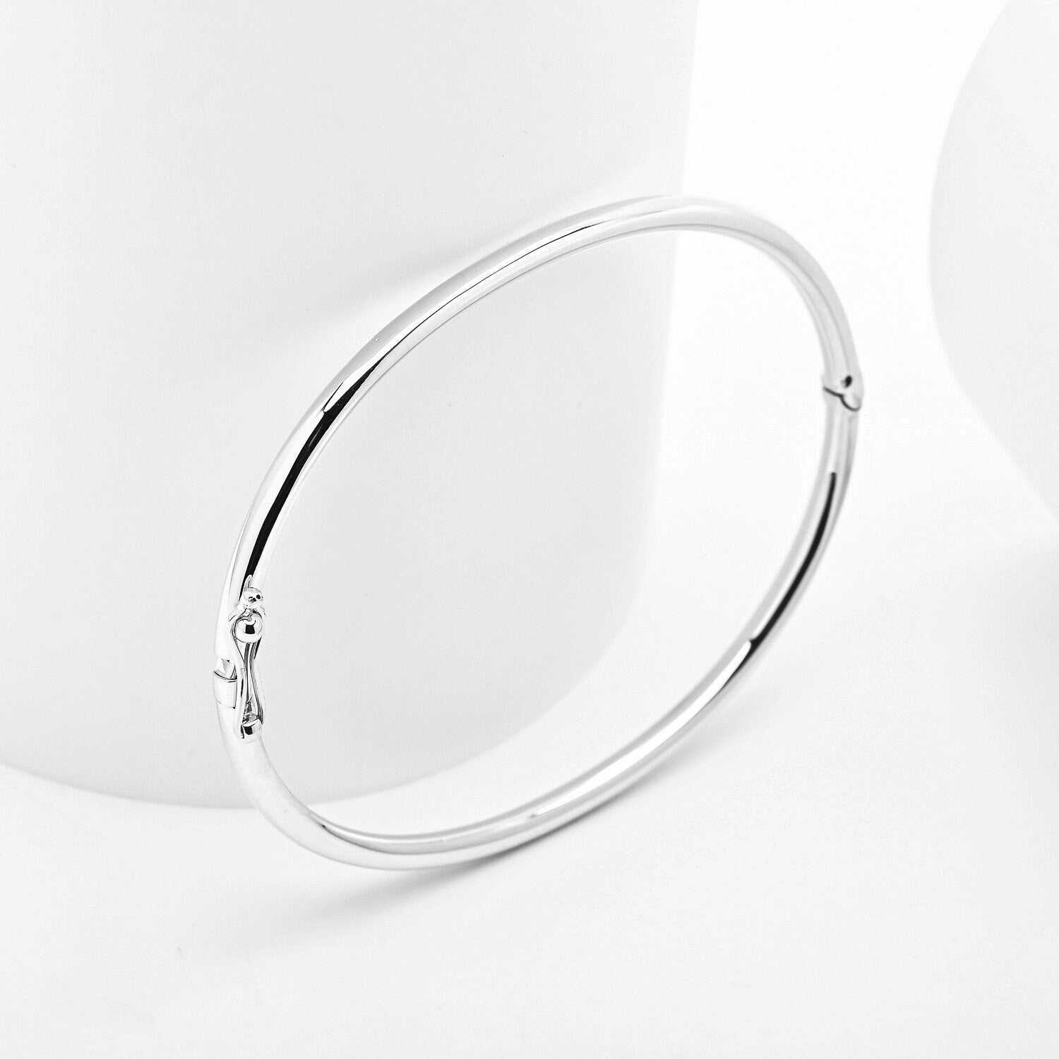 14k white Gold bangle bracelet on a white background