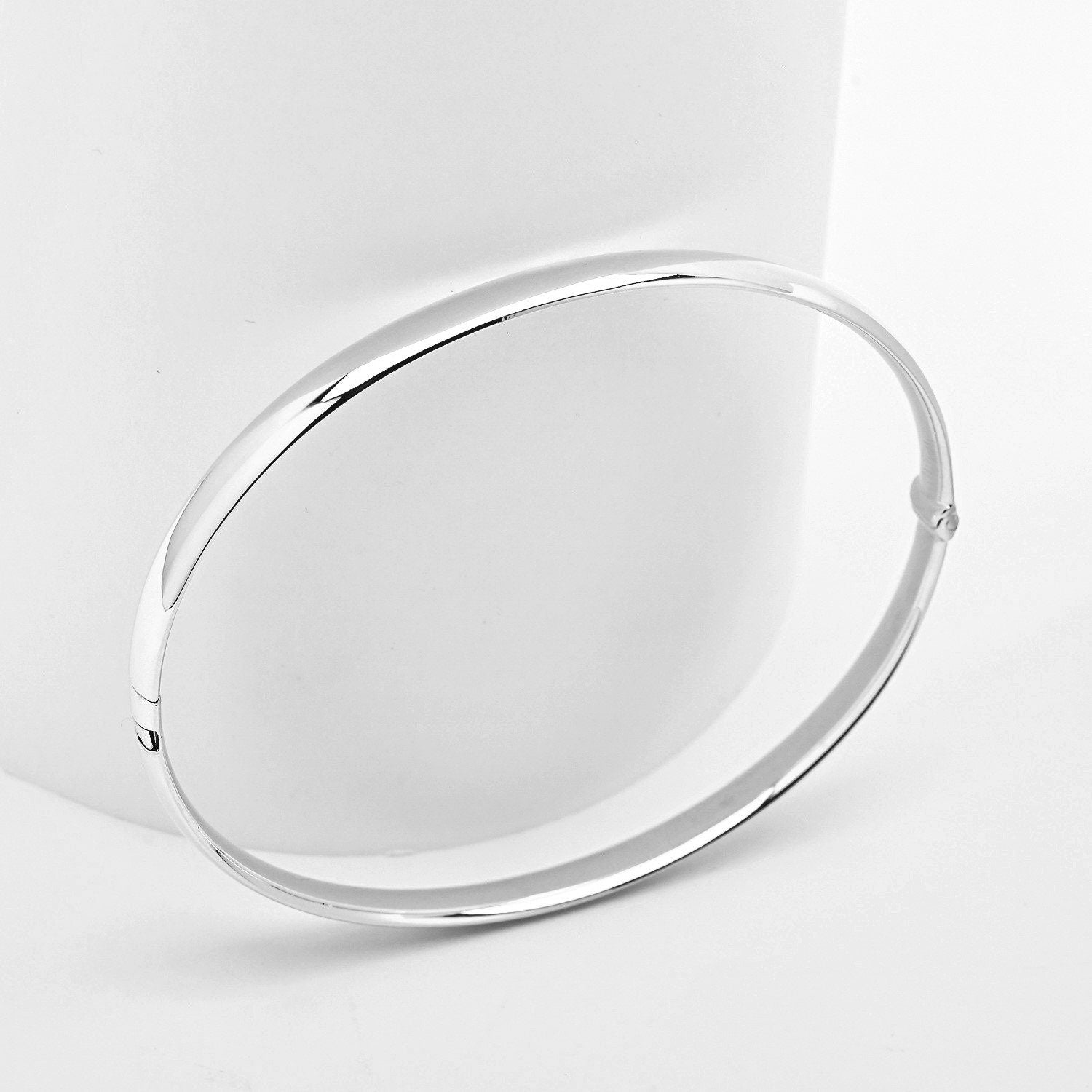 14k white Gold bangle bracelet on a white background