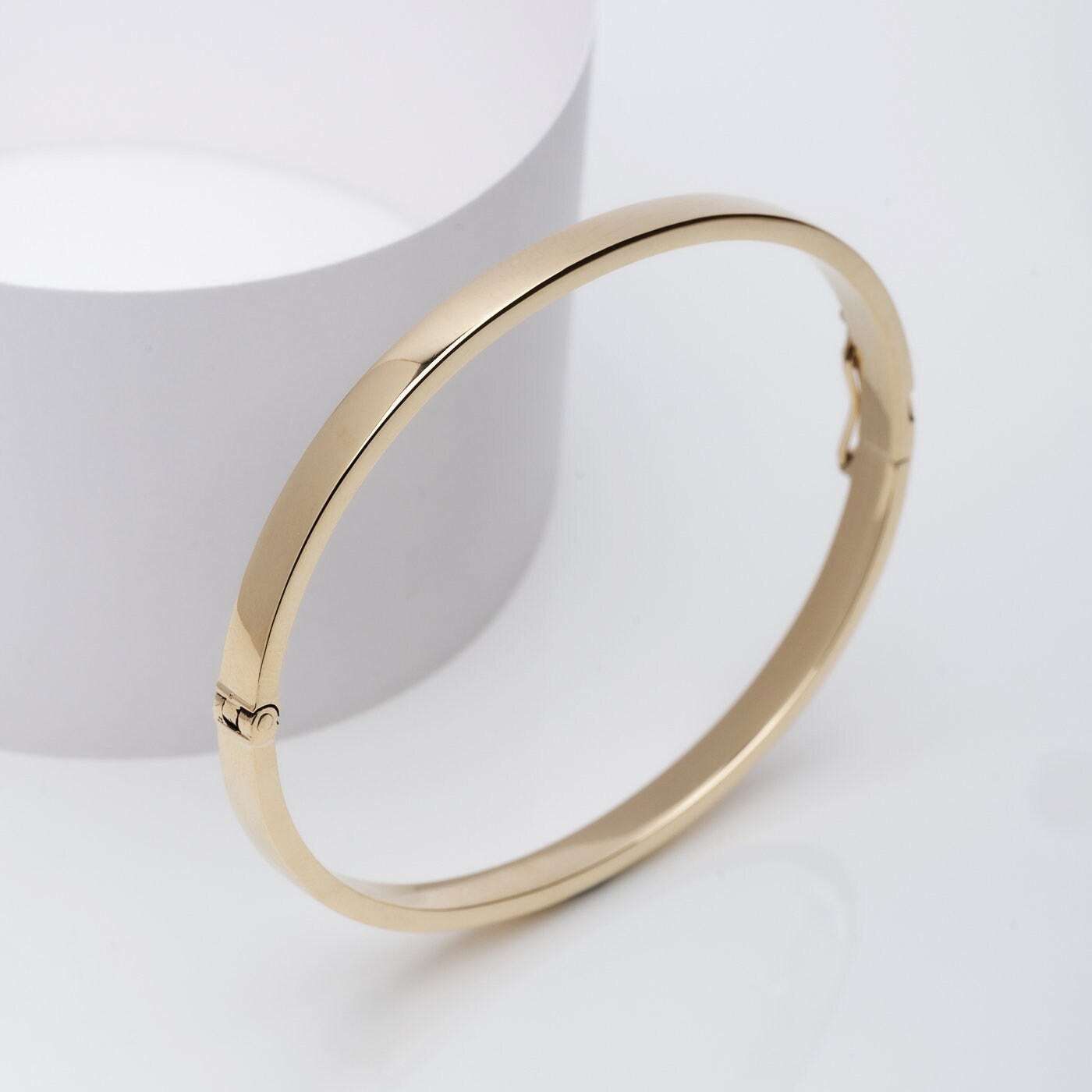 A 4.50mm bangle bracelet crafted in 14k gold.