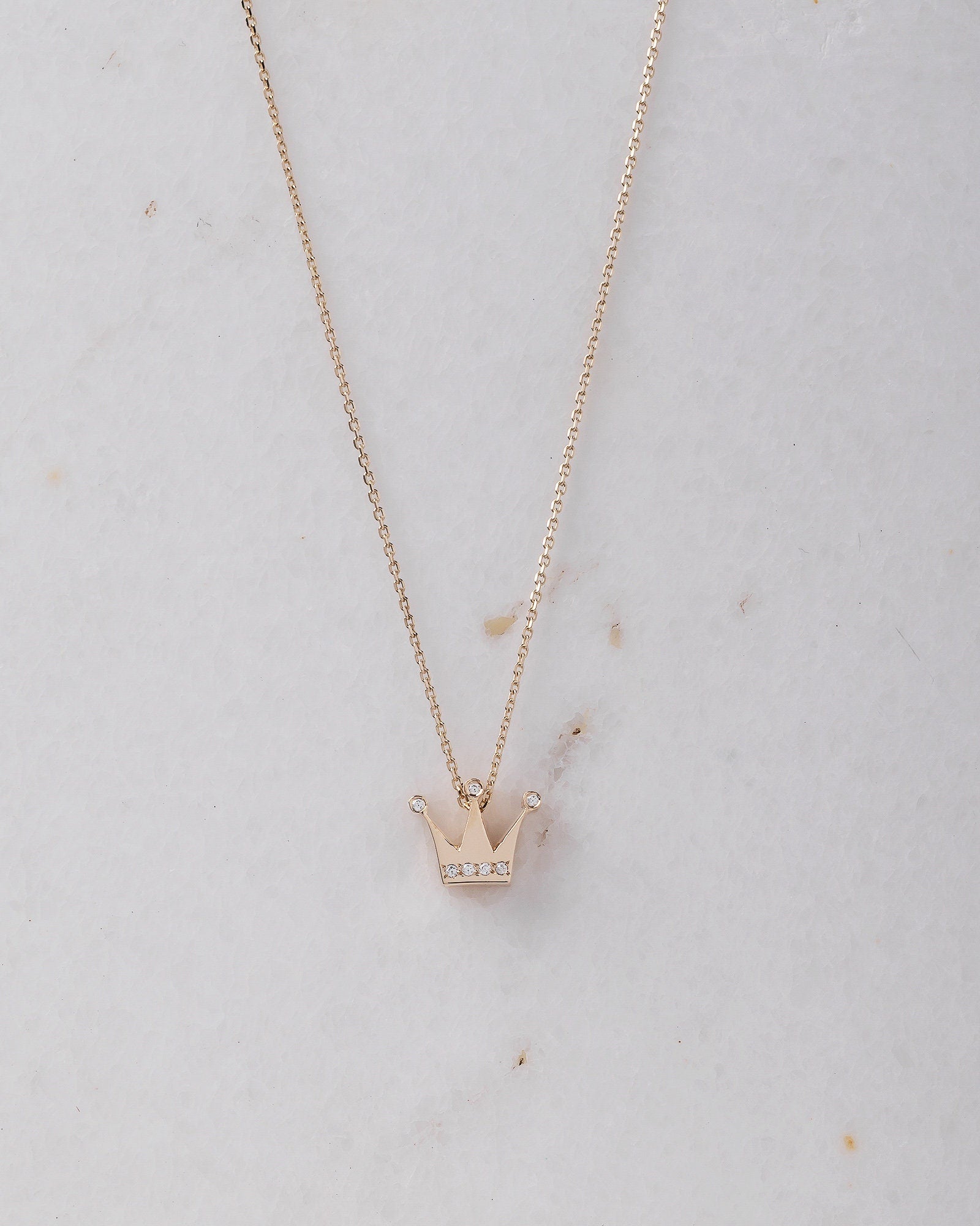 crown necklace in 14k yellow gold with cubic zirconia stones