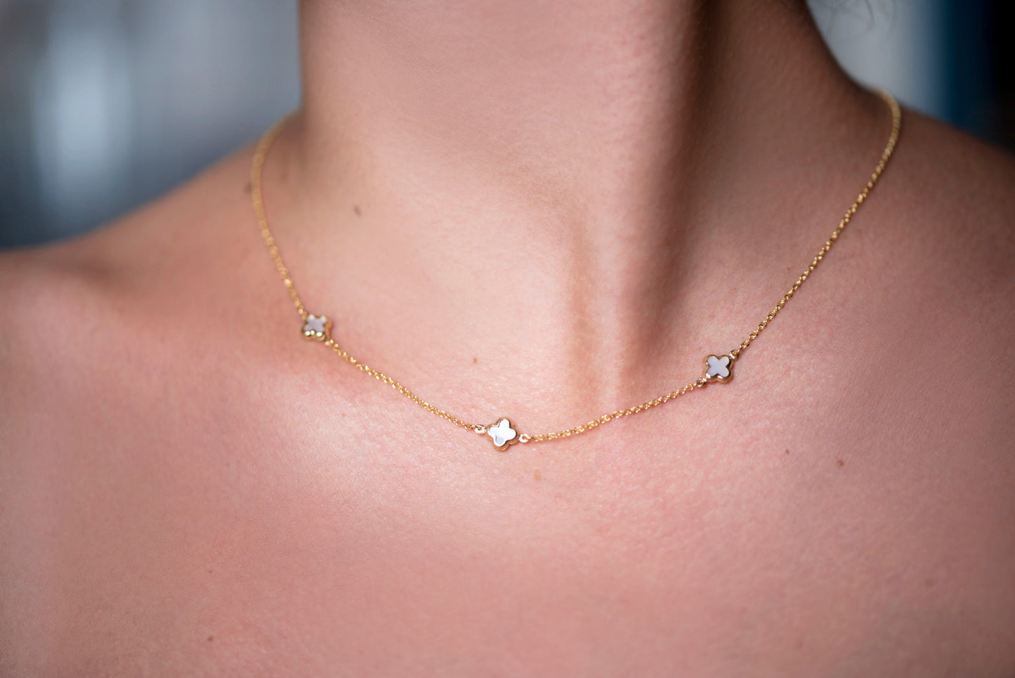 Elegant Four Leaf Clover Necklace featuring three mother-of-pearl motifs set in 14k gold.